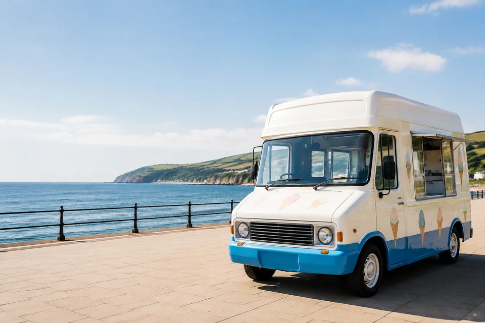 An ice cream van parked by the seaside